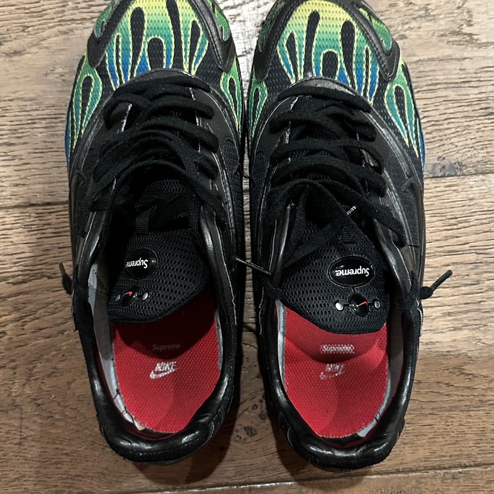 Supreme Black Sneakers with Red and Blue Accents